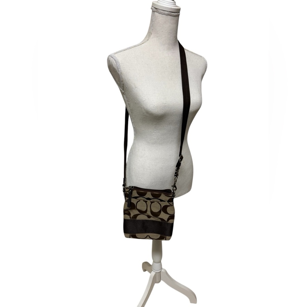 Ladies coach Crossbody. Brown and tan and color.